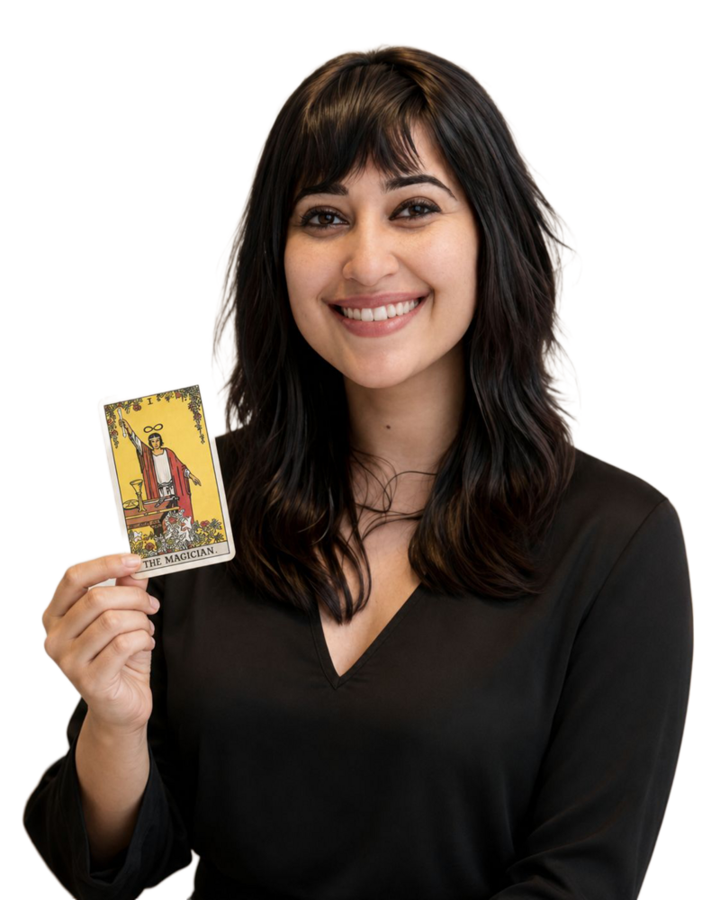 Geetika Khurana, tarot & spiritual card reader, holding The Magician card