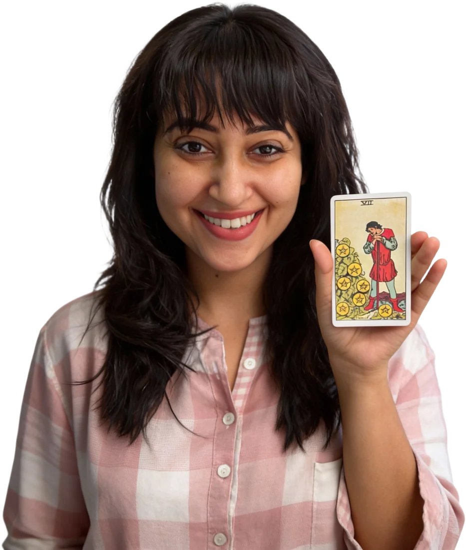 Geetika Khurana holding the Seven of Pentacles tarot card