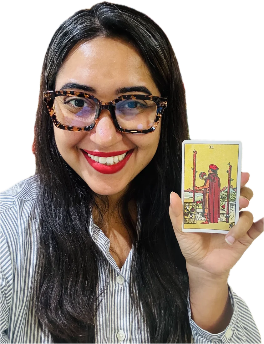 Geetika Khurana holding the Two of Wands tarot card