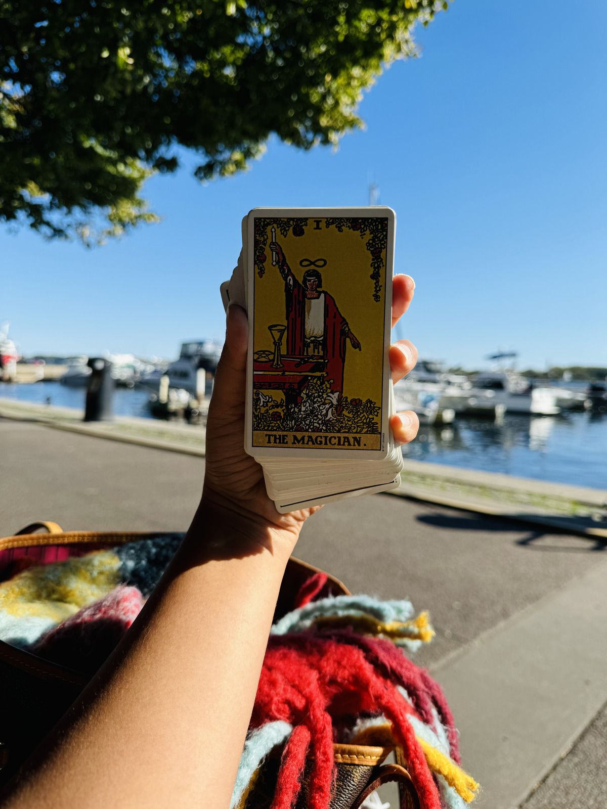 Geetika Khurana holding The Magician tarot card